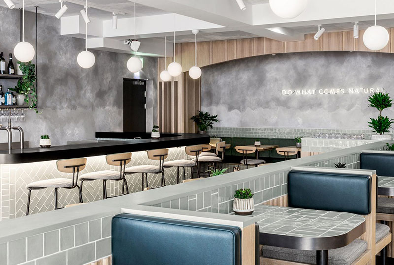 Gorgeous restaurant with concrete walls and wood elements from London
