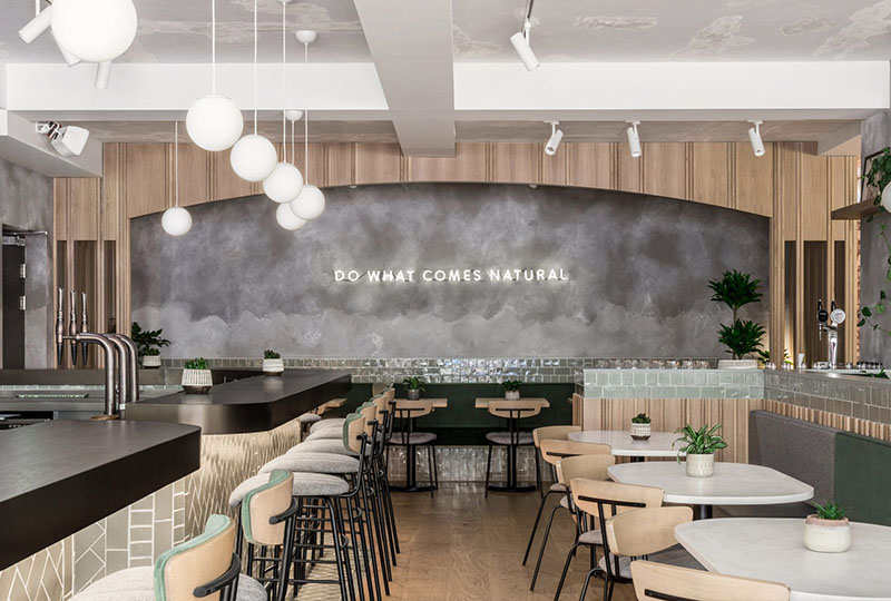 Gorgeous restaurant with concrete walls and wood elements from London